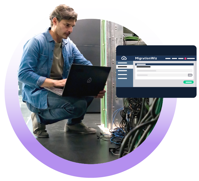 Tech employee in server room using MigrationWiz